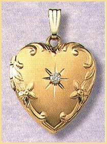 14K gold heart locket with four point genuine diamond