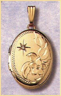 14K gold oval locket with a one point diamond