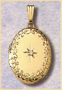 14K gold oval locket with a two point diamond